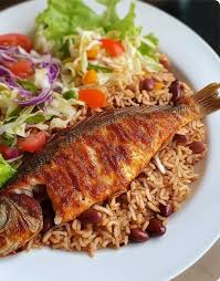 Ghana Coconut Rice, salad, and Titus Fish 